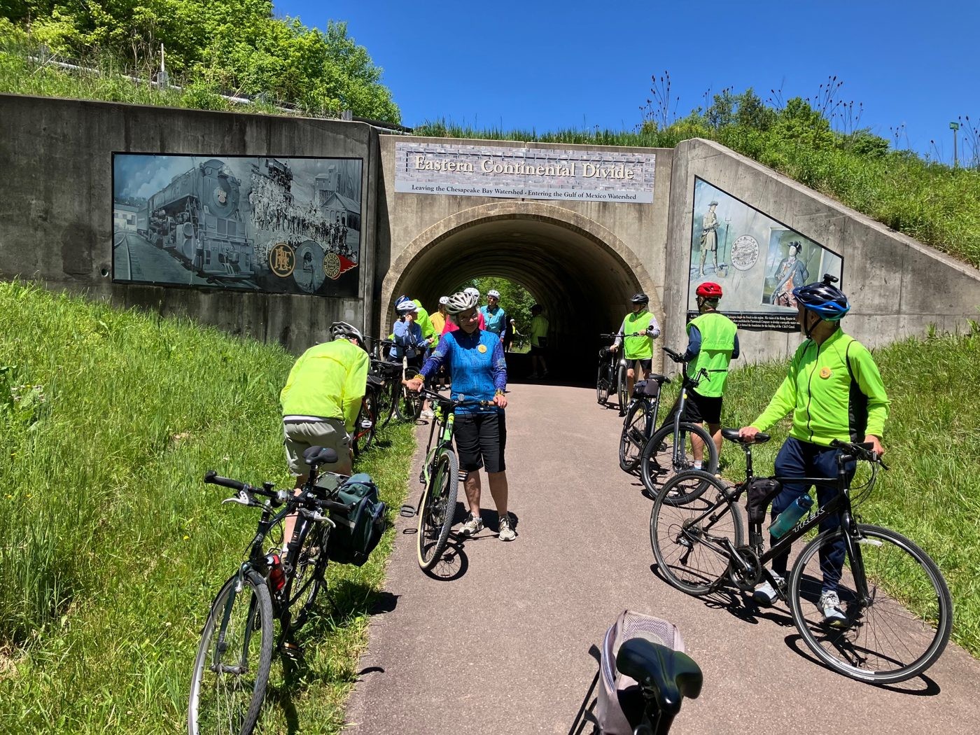 Senior Spokes riders pausing at a tunnel on the trail